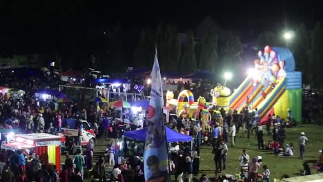 Crowd-of-citizens-at-carnival-at-night-celebrates-the-anniversary-of-the-city