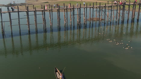 Man-on-Canoe,-U-Bein-Bridge,-Mandalay,-Myanmar,-Aerial-Establishing-Shot