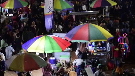 Crowd-of-citizens-at-carnival-at-night-celebrates-the-anniversary-of-the-city