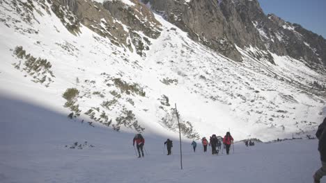 Mountaineers-Hike-Steep-Snowy-High-Tatras-Mountain-Trail,-Slovakia,-slow-motion