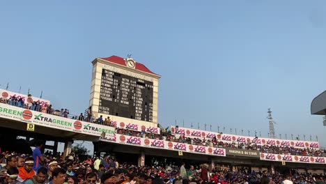 Tilt-up-shot-over-crowded-Eden-gardens-cricket-stadium-during-India-vs-Sri-Lanka-match-at-Kolkata,-West-Bengal,-India-during-evening-time