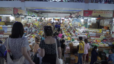 Shoppers-walk-down-stairs-and-lead-to-vendor-stalls-making-transactions