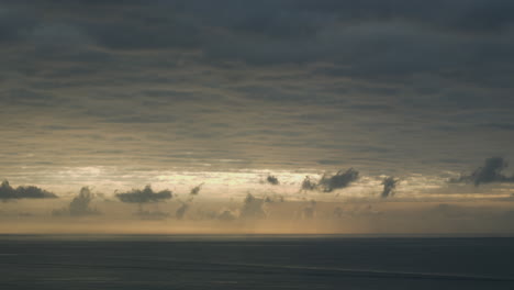 dramatic-time-lapse-captures-dark-dusky-sky-moving-above-sea-horizon