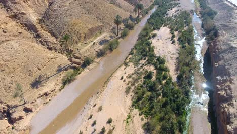 drone-shot-of-a-canyon-between-desert-mountains-in-bousaada-algeria