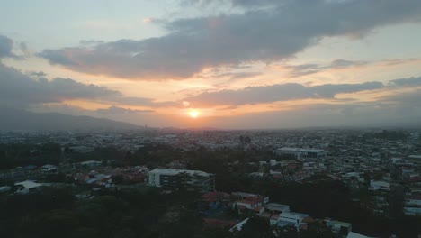 Beautiful-Drone-Shot-of-Sunset-over-San-Jose-Costa-Rica-During-Golden-Hour