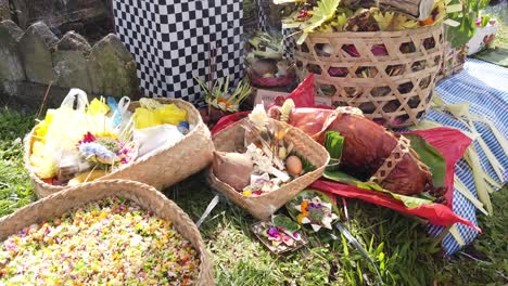 Balinese-Offerings-and-People-in-Religious-Temple-Ceremony,-Sage-Smoke,-Flowers,-Incense,-Animal-Food-for-the-Gods-and-Colorful-Ornaments,-Pura-Besakih,-Karangasem