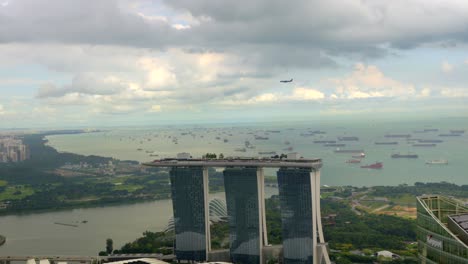 Airplane-Singapur-view-from-rooftop-building-Marina-Bay-Helix-bridge-Flyers-Museum-tilt-shot