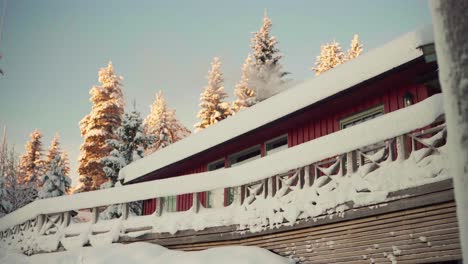 Red-Cabin-In-Snowy-Area-Surrounded-By-Fir-Trees-In-Winter-In-Indre-Fosen,-Norway