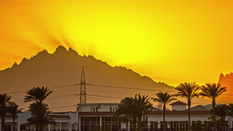 Hurghada-Mountains-Time-Lapse-at-Sunset-with-Orange-Sun-Setting-Down,-Egypt,-Africa
