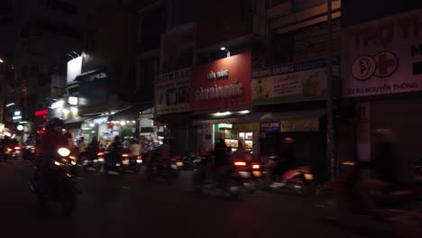 Night-motorbike-ride-in-traffic-in-Ho-Chi-Minh-City,-Vietnam