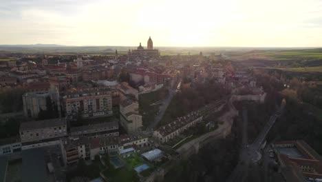 Aerial-ascent-over-Spanish-city-of-Segovia-at-sunset-time