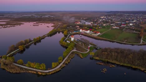 Mesmerizing-Sunset-Timelapse--A-Vibrant-Aerial-View-of-Comana-Natural-Park-Delta-with-Lush-Green-Vegetation,-Romania