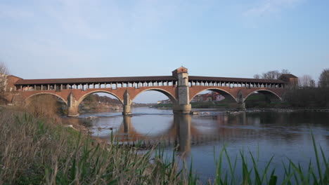 Ponte-Coperto-is-a-bridge-over-the-Ticino-river-in-Pavia-at-sunny-day,slow-motion,-lombardy,-Italy