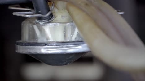 Filling-Milk-Container-From-Robotic-Milking-System,-Close-up