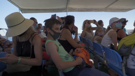 Group-Of-Tourists-Aboard-A-Passenger-Boat-Cruising-The-Sea-Waters-During-Pandemic-In-Croatia