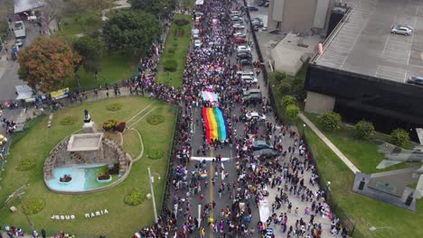 Drone-video-of-people-gathering-to-celebrate-pride-month-in-Lima,-Peru