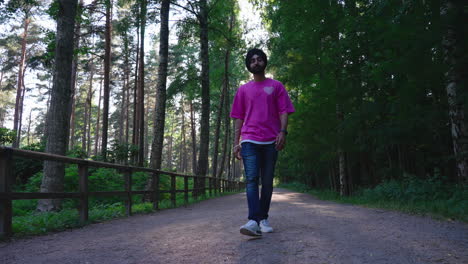 Indian-Punjabi-Sikh-Man-Walking-In-The-Forest-With-Bright-Sun-In-The-Background