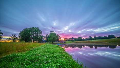 Timelapse-of-pink-sunset-and-summer-pond-and-house