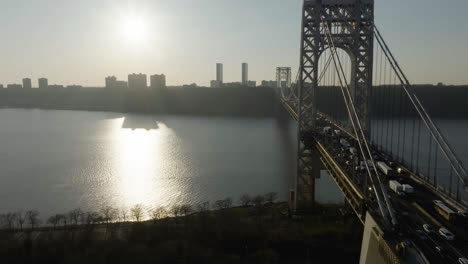 Drone-shot-following-the-George-Washington-bridge,-towards-sunny-New-Jersey,-USA