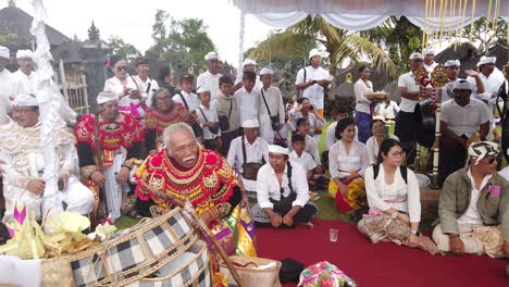 Balinese-Ceremony-with-Masked-Dance-Topeng,-Gamelan-and-Bali-People-Dressed-in-Ceremonial-Clothes,-at-Besakih-Mother-Temple