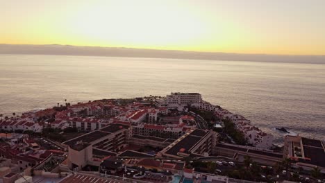 View-at-small-town-Santiago-Del-Teide,-sunset-above-sealine