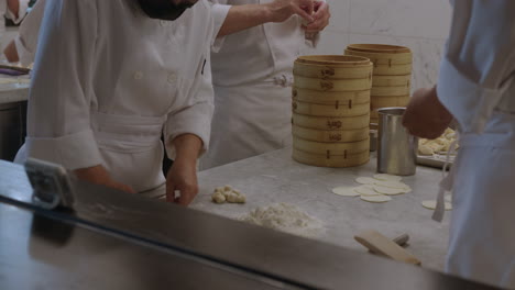Slow-Motion-Close-Up-of-Chefs-Making-Dumplings