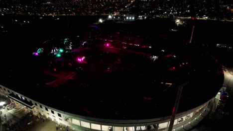 Incredible-set-of-lights-glowing-in-big-concert-in-outdoor-stadium-at-night