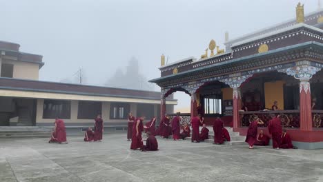 Indian-Buddhist-monks-participate-at-a-debate-session-at-the-Lava-monastery-in-West-Bengal,-India