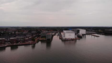 Aerial-View-Of-Moored-Luxury-Yacht-At-Oceanco-Shipyard-Marina-Located-In-Alblasserdam-On-2-July-2022-On-Overcast-Day