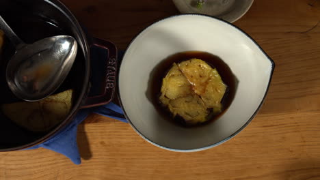 Dishing-up-deep-fried-KAMONASU-at-home-kitchen,-Tokyo,-Japan