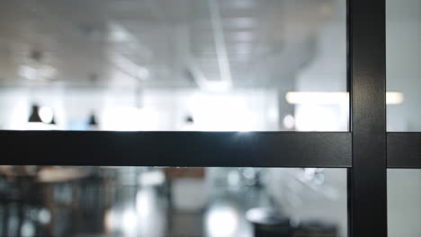 Black-aluminium-window-frame-with-office-in-the-background