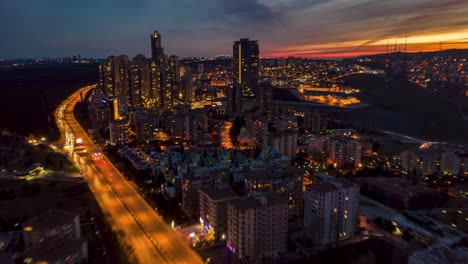 Ankara-moving-time-lapse-by-sunset-with-rush-hour-traffic,-cars-and-skyscrapers-from-a-drone