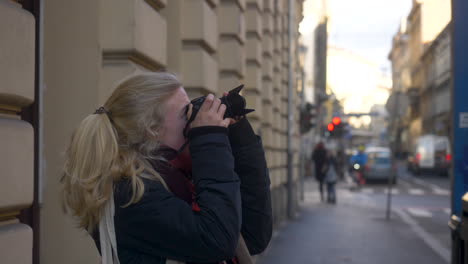 Woman-taking-a-picture-outside-in-the-city-centre-of-Zagreb