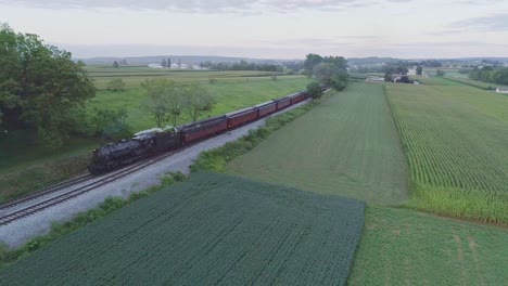 Aerial-View-on-an-Approaching-Steam-Passenger-Train-in-the-Amish-Countryside-on-a-Summer-Day