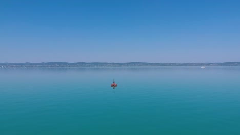 Red-Bouy-at-the-lake-Balaton,-Hungary-Siofok-Recorded-with-a-Dji-drone-1080p