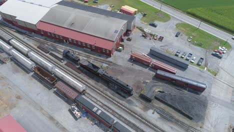 Aerial-View-of-a-Train-Yard-with-a-Steam-Engine-N-W-611-Warming-Up-on-a-Sunny-Summer-Day