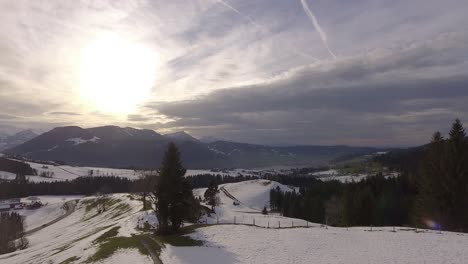 Beautiful-open-winter-panorama-with-a-road-and-a-lake-in-Switzerland