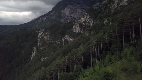 Aerial-view-of-the-mountains-and-forest-in-Borgo-Valsugana-in-Trentino-Italy-with-drone-flying-forward