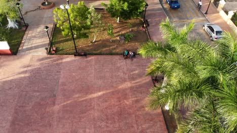 Aerial-shot-of-couple-in-San-Juan-Park-Valladolid-Yucatan,Mexico