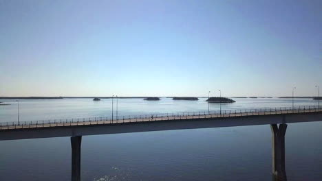 Man-running-marathon-on-Replot-bridge,-Finland