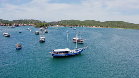 Aerial-shot-of-Buzios-coast-and-boats-sailing-Brazil