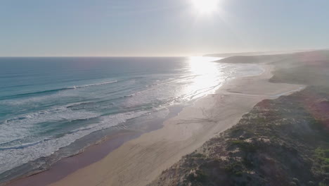 Aerial-shot-moving-over-a-sandy-beach-and-coastline-in-South-Australia