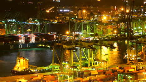 Singapore---Circa-Timelapse-of-busy-shipping-port-at-night-in-Singapore