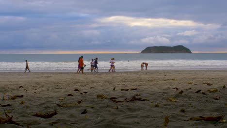 Runners-going-past-on-Espadilla-Beach-in-Manuel-Antonio