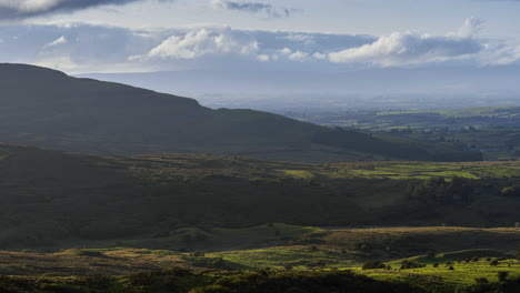 Timelapse-of-rural-nature-farmland-with-hills-in-distance-during-sunny-day-viewed-from-Carrowkeel-in-county-Sligo-in-Ireland