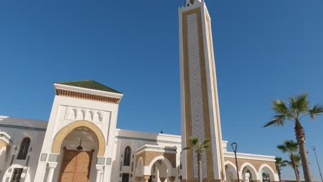 Tilt-down-shot-of-Masjid-Lalla-Abosh-mosque-in-Tangier-on-sunny-day,-Morocco