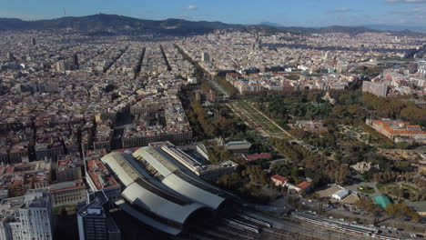 Drone-shot-of-Barcelona-city---drone-is-flying-high-over-Parc-de-la-Ciutadella