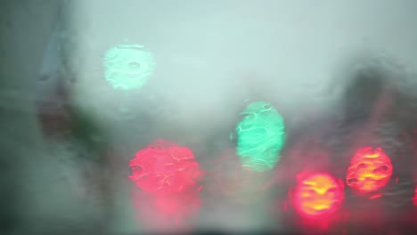 Close-up-of-water-droplets-on-glass,-Rain-Go-Away,-Large-raindrops-strike-a-window-pane-during-a-summer-shower,-4K,-Rain-series---7