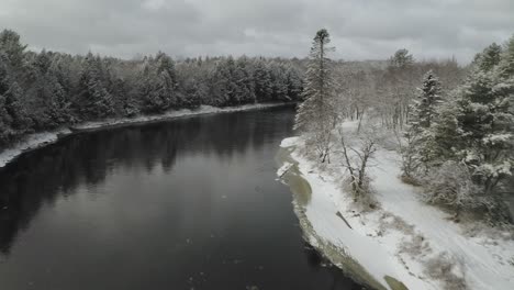 Forest-covered-with-snow-along-Piscataquis-river