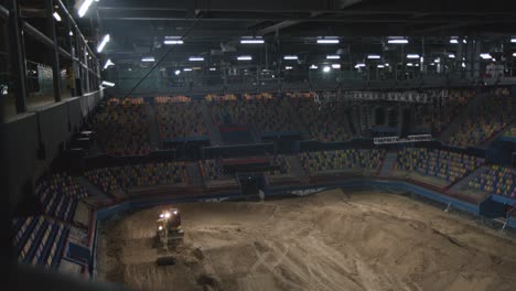 Heavy-machine-building-dirtbike-track-inside-stadium